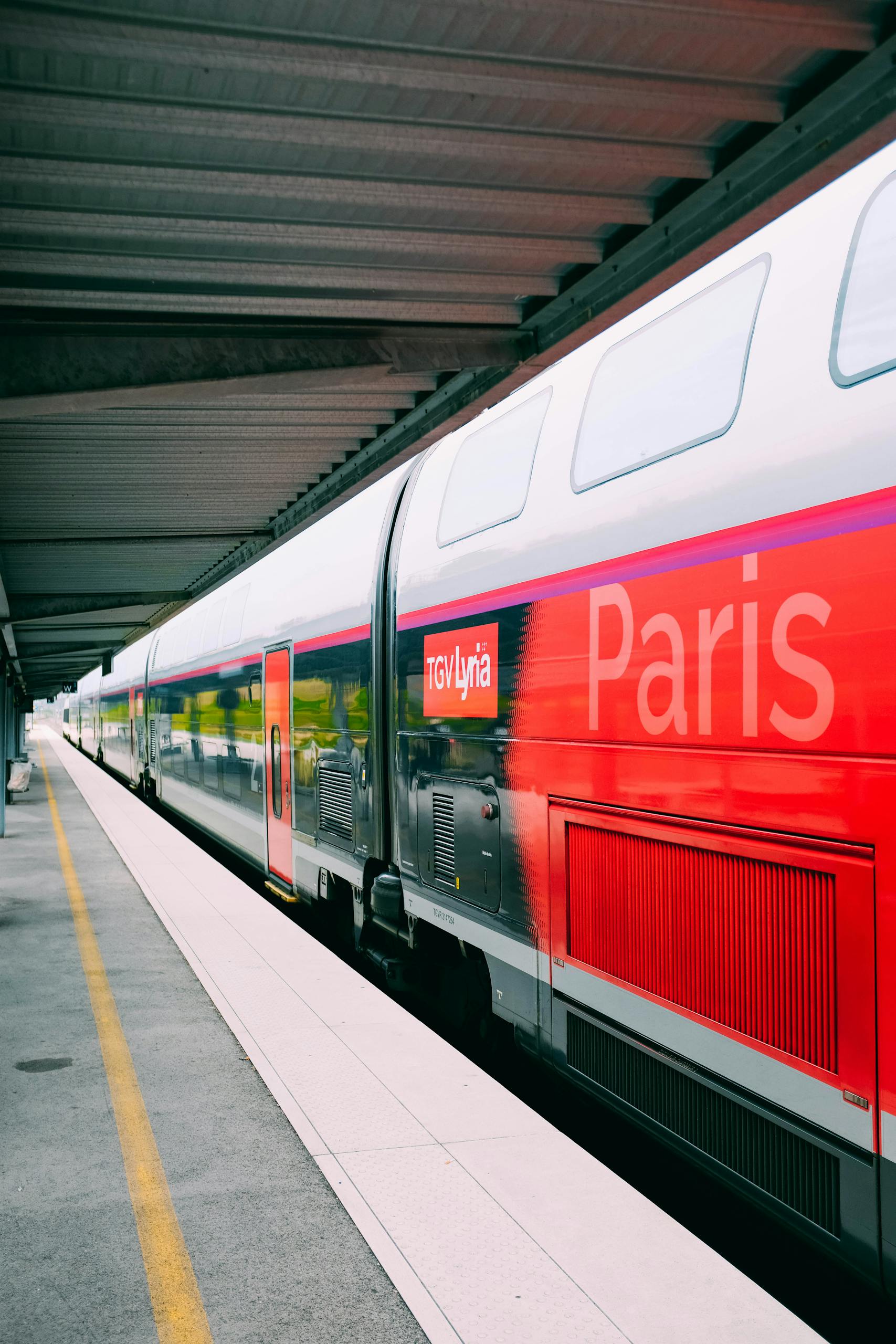 A sleek TGV train at a Paris railway station, showcasing modern design in public transportation.